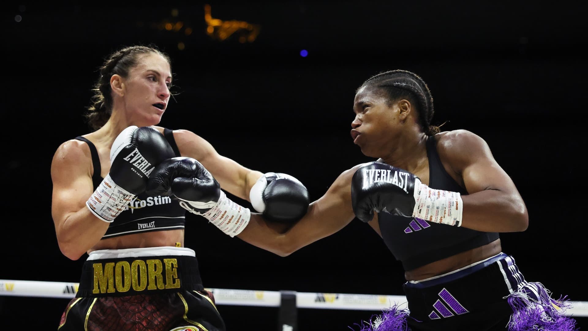 Dubois Dominates Moore, Retains Lightweight Titles On Points